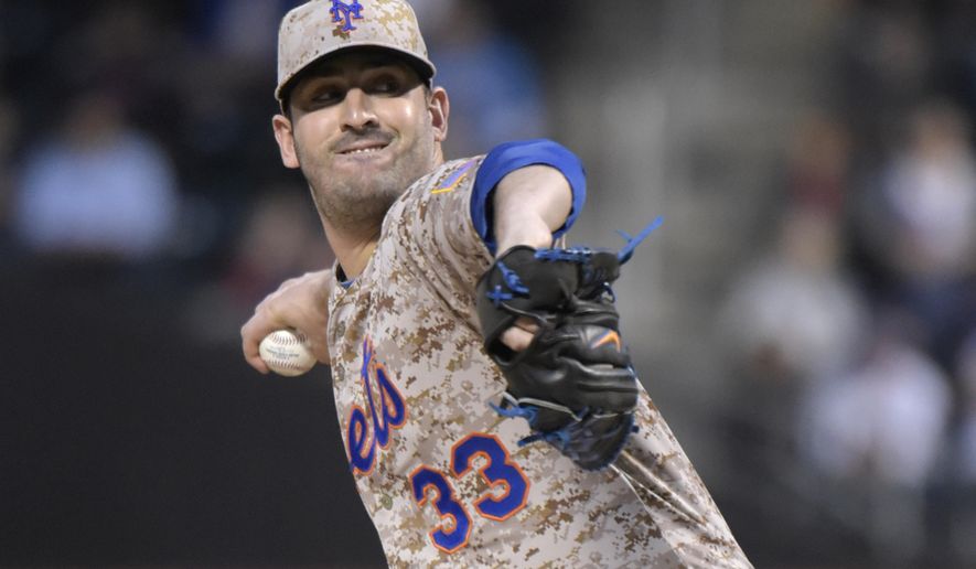 New York Mets pitcher Mat Harvey delivers the ball to the St. Louis Cardinals during the second inning of a baseball game Monday, May 18, 2015, at Citi Field in New York. (AP Photo/Bill Kostroun)