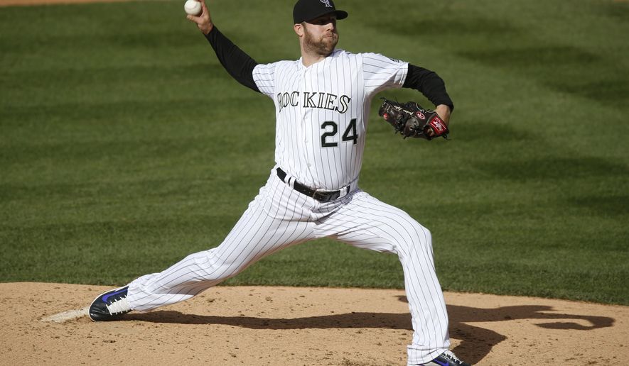 Colorado Rockies starting pitcher Jordan Lyles works against the San Francisco Giants during the fourth inning of the first game of a baseball doubleheader Saturday, May 23, 2015, in Denver. (AP Photo/David Zalubowski)