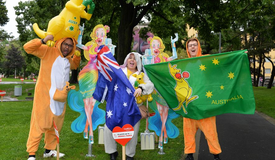 Fans of Australia pose for photos in the song contest park in front of the City Hall prior to the final of the Eurovision Song Competition in Austria's capital Vienna, Saturday, May 23, 2015. (AP Photo/Kerstin Joensson)