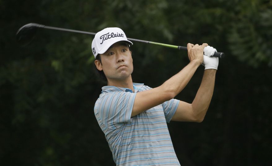 Kevin Na watch his tee shot on the sixth hole during the third round of the Colonial golf tournament Saturday, May 23, 2015, in Fort Worth, Texas. (AP Photo/LM Otero)