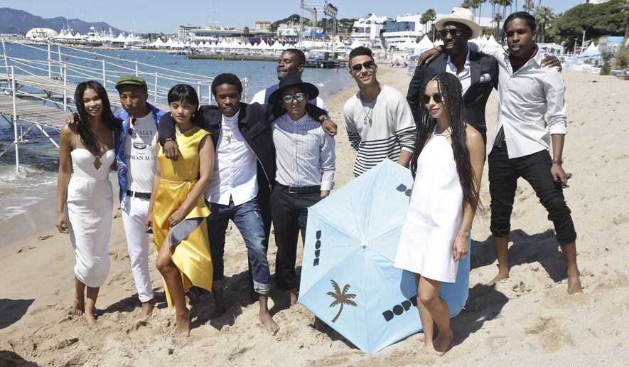 From left, Chanel Iman, Pharell Williams, Kiersey Clemons, Shameik Moore, Amin Joseph, Tony Revolori, Quincy Brown, Zoe Kravitz, Rick Famuyiwa and A$AP Rocky pose for photographers during a photo call for the film Dope, at the 68th international film festival, Cannes, southern France, Friday, May 22, 2015. (Photo by Joel Ryan/Invision/AP)