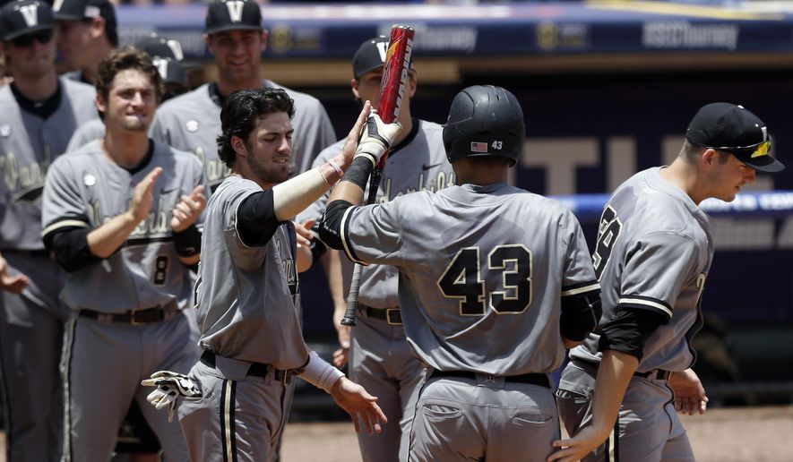 Vanderbilt’s Zander Wiel (43) celebrates with teammates after hitting a home run against Texas A&amp;amp;M during the third inning of an NCAA college baseball game in the Southeastern Conference tournament, Saturday, May 23, 2015, at the Hoover Met in Hoover, Ala. (AP Photo/Butch Dill)