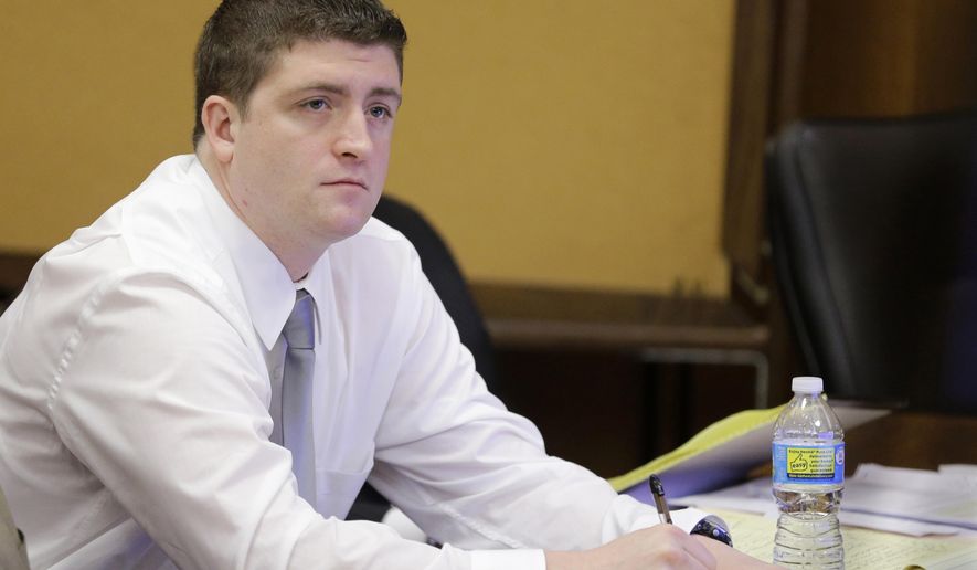 FILE - In this April 9, 2015, file photo, Cleveland police Officer Michael Brelo listens to testimony during his trial in Cleveland. A judge has reached a verdict in the trial of Brelo charged with voluntary manslaughter in the shooting deaths of two unarmed people in a 137-shot barrage of police gunfire. Saturday, May 23, 2015 verdict comes after four weeks of testimony in Brelo's trial in the deaths of Timothy Russell and Malissa Wiliiams in November 2012. (AP Photo/Tony Dejak, Pool, File)