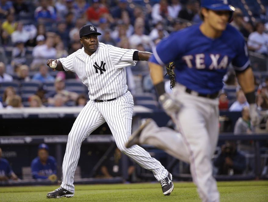 New York Yankees starting pitcher Michael Pineda looks to first as Texas Rangers&#39; Tommy Field runs to first base during the third inning of a baseball game Friday, May 22, 2015, in New York. Fields was safe on the play. (AP Photo/Frank Franklin II)