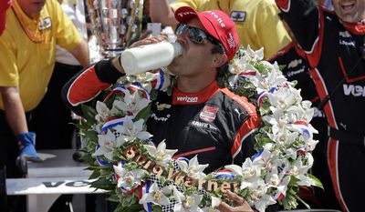 Juan Pablo Montoya, of Colombia, celebrates after winning the 99th running of the Indianapolis 500 auto race at Indianapolis Motor Speedway in Indianapolis, Sunday, May 24, 2015.  (AP Photo/Darron Cummings)