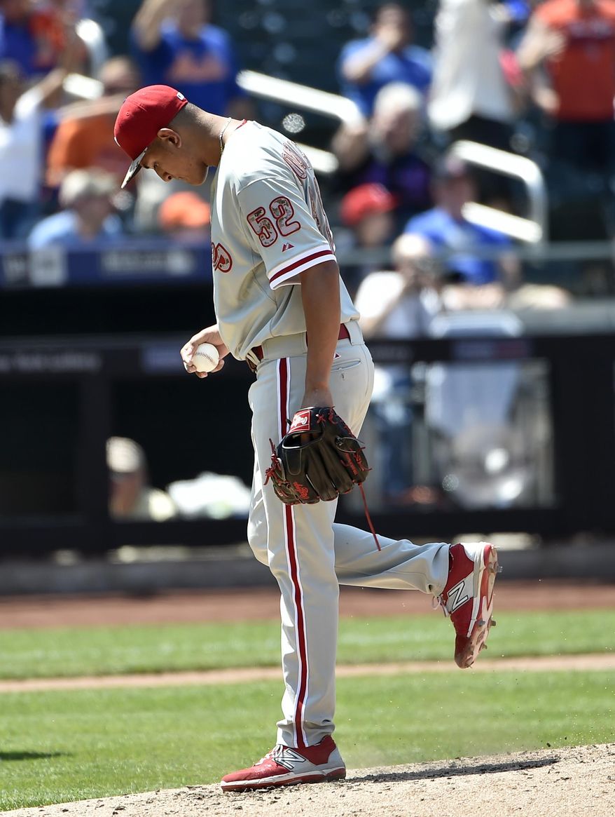 Philadelphia Phillies starting pitcher Severino Gonzalez (52) reacts on the mound after New York Mets left fielder Michael Cuddyer hits a solo home run in the fourth inning of a baseball game at Citi Field on Monday, May 25, 2015, in New York. (AP Photo/Kathy Kmonicek)