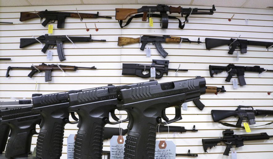 Assault weapons and handguns are seen for sale at Capitol City Arms Supply in Springfield, Illinois. Residents of Arlington, Virginia, are trying to bully Marine Corps veteran James Gates, 28, from opening a gun shop in their neighborhood. (Associated Press)