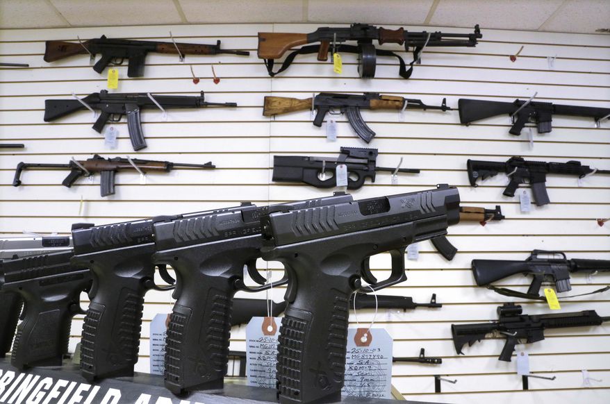 Assault weapons and handguns are seen for sale at Capitol City Arms Supply in Springfield, Illinois. Residents of Arlington, Virginia, are trying to bully Marine Corps veteran James Gates, 28, from opening a gun shop in their neighborhood. (Associated Press)