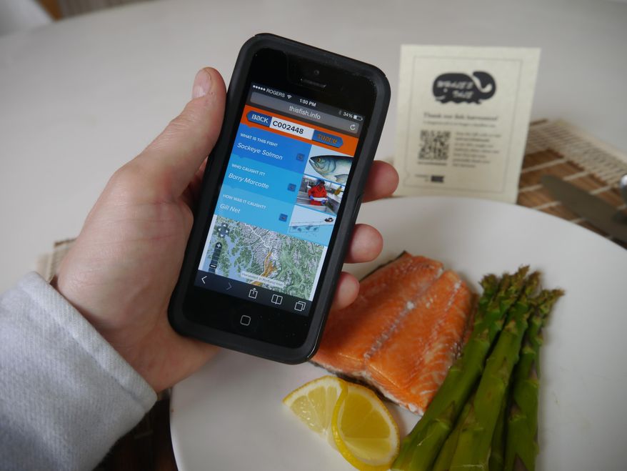 This April 2015 photo provided by Ecotrust Canada via This Fish shows the "Boat To Plate" smartphone app being created by a group of Maine fishermen and scientists that will allow consumers to source seafood all the way back to the fishermen who caught it. The app is in the development phase, but has already earned a nod from the feds in the form of a grant. (Eric Enno Tamm/Ecotrust Canada via AP)
