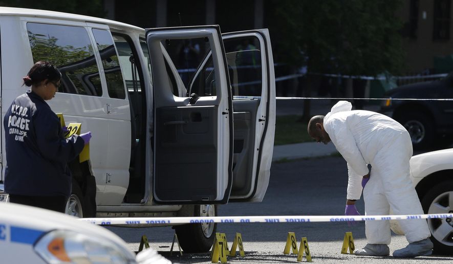 Police conduct an investigation at the scene of a shooting in Brooklyn's East New York section, New York, Tuesday, May 26, 2015. The New York Police Department says a man suspected of killing his ex-girlfriend outside a casino has been shot to death by police. (AP Photo/Seth Wenig)
