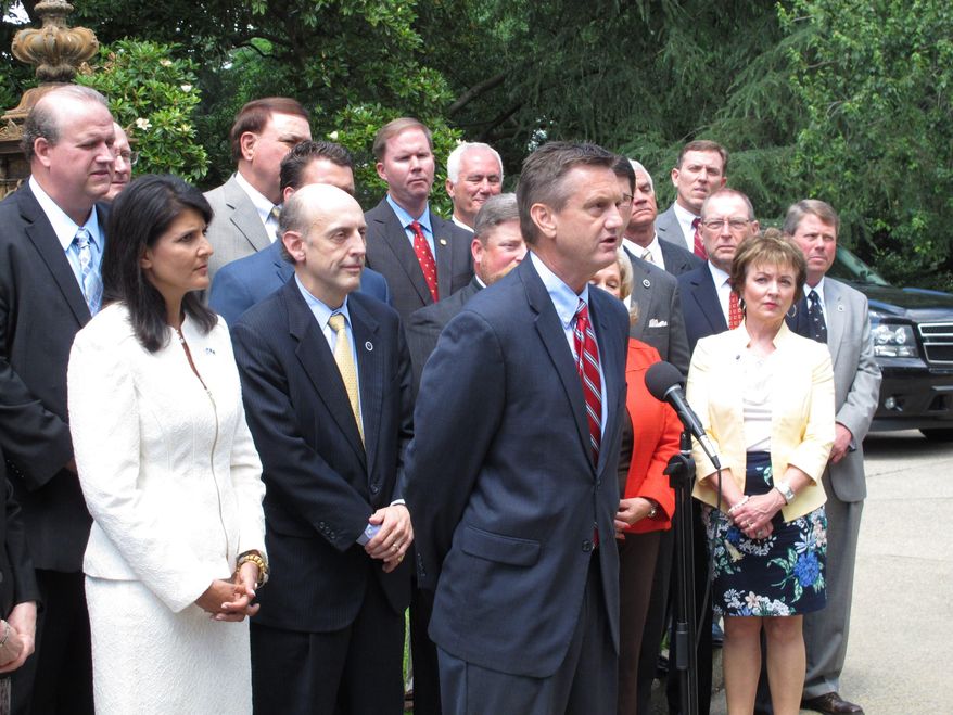 South Carolina Sen. Tom Davis, R-Beaufort, speaks about his filibuster of plans on how to spend extra money in the South Carolina budget during a news conference called by Gov. Nikki Haley on Tuesday, May 26, 2015, in Columbia, S.C. Haley said the Legislature needs to give a tax cut, pay off debt or fix the state's roads and bridges with the extra revenue. (AP Photo/Jeffrey Collins)