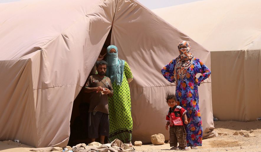Displaced Iraqi civilians from Ramadi stand in a refugee camp west of Baghdad. The Islamic State&#x27;s rout of Ramadi exposed more than the Iraqi army&#x27;s lack of will to fight. After months of U.S. and coalition airstrikes on Islamic State targets, U.S. surveillance and intelligence collection, and with senior American officers advising Iraqis at a joint command center, the battlefield outcome still was no better than the rout of Mosul. (Associated Press)
