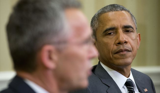 President Barack Obama listens as NATO Secretary General Jens Stoltenberg speaks to members of the media during their meeting, Tuesday, May 26, 2015, in the Oval Office of the White House in Washington. (AP Photo/Pablo Martinez Monsivais)