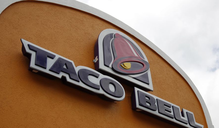 This Friday, May 23, 2014, file photo shows a sign at a Taco Bell in Mount Lebanon, Pa. (AP Photo/Gene J. Puskar, File)