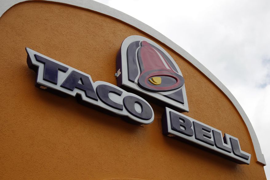 This Friday, May 23, 2014, file photo shows a sign at a Taco Bell in Mount Lebanon, Pa. (AP Photo/Gene J. Puskar, File)