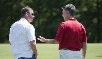 Washington Redskins general manager Scot McCloughan, left, talks with team president Bruce Allen during an NFL football organized team activity at Redskins Park, on Tuesday, May 26, 2015, in Ashburn, Va. (AP Photo/Evan Vucci) **FILE**