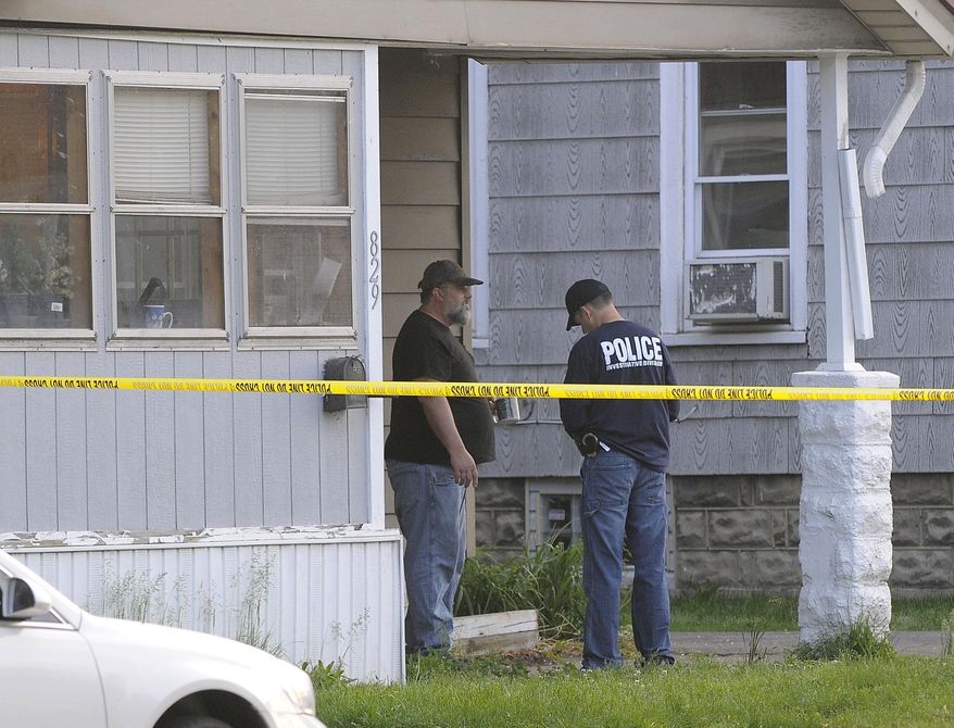 Port Huron police speak to Frank Hawkins about the investigation of the death of a five-year-old child Wednesday, May 27, 2015, in Port Huron, Mich. Police say an apparently malnourished 5-year-old girl found at a Port Huron home has died and three other children have been removed from the home during the investigation. Hawkins is the grandfather of the child. (Mark R. Rummel/The Port Huron Times Herald via AP) NO SALES