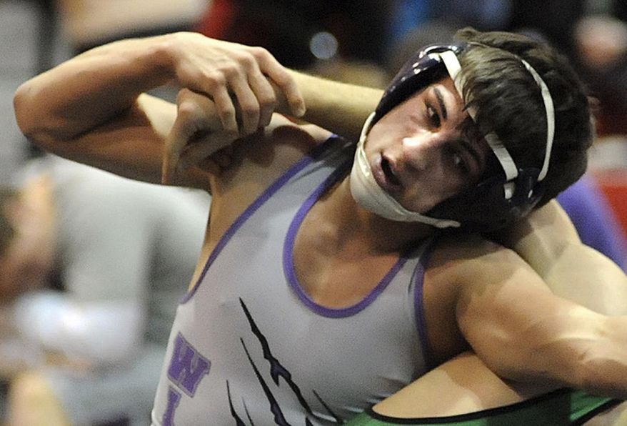 FILE-This Jan. 16, 2014 file photo shows Keystone High School wrestler Logan Stiner during a match in Sheffield Village, Ohio. A measure barring the sale of pure caffeine products has cleared the Ohio House after representatives moved to also prohibit the sale of powdered or crystalline alcohol. The House passed the legislation on a 92-3 vote Wednesday, May 27, 2015 which was the anniversary of an Ohio teen's death from caffeine powder. Eighteen-year-old Stiner died days before his high school graduation after consuming a lethal dose of the powdery substance. (Steve Manheim, The Chronicle Telegram via AP, File)