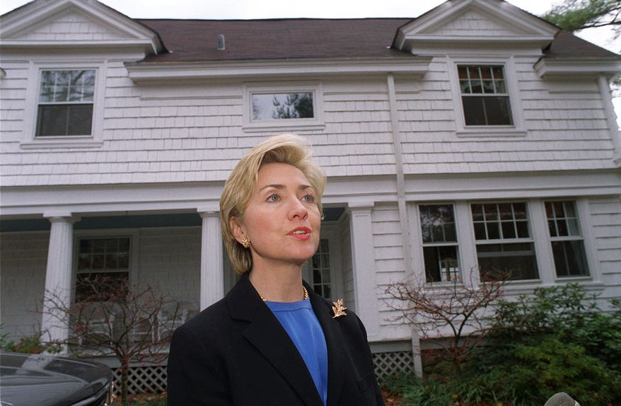 In this Nov. 3, 1999, file photo, then-first lady Hillary Rodham Clinton speaks to the media in front of the Clinton's newly purchased home in Chappaqua, N.Y., The server computer that transmitted and received Hillary Clinton’s emails on a private account she used exclusively for official business when she was secretary of state traced back to a residential Internet service registered at her family’s five-bedroom home in Chappaqua, according to Internet records reviewed by The Associated Press. (AP Photo/Stephen Chernin, File)