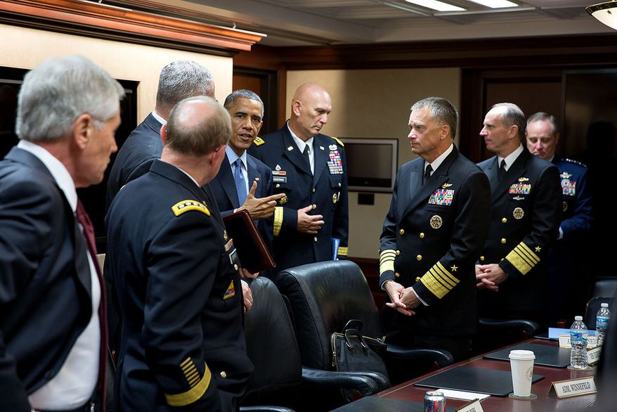 President Barack Obama talks with the Joint Chiefs of Staff following a meeting in the Situation Room of the White House, Oct. 28, 2014. (Official White House Photo by Pete Souza)