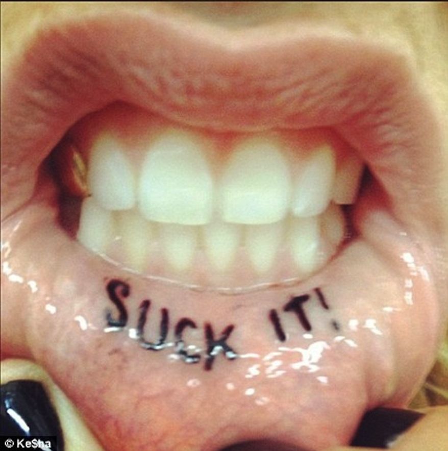 Ke$ha - First, Kesha moved from working behind the scenes as a songwriter to performing on stage as a singer. Then, she chose to make her mouth even more visible with a tattoo of the phrase “Suck It” on her inner lip. The 28-year-old artist got the tattoo in Los Angeles at Alchemy Tattoo on Sunset Boulevard in 2012. Given Kesha’s history on Twitter and on her blog “Put Your Beard in My Mouth,” it’s no surprise that she hasn’t been shy about showing it off on the internet. 