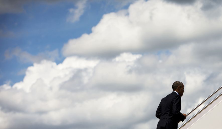 President Barack Obama walks up the stairs of Air Force One before his departure from Andrews Air Force Base, Md., Wednesday, May 27, 2015, en route to Miami. Obama is traveling to Miami to raise money for the Democratic National Committee at a pair of events at the homes of well-heeled political donors and tomorrow he will visit the National Hurricane Center to draw attention to preparedness in advance of the annual storm season that formally begins June 1. (AP Photo/Pablo Martinez Monsivais)