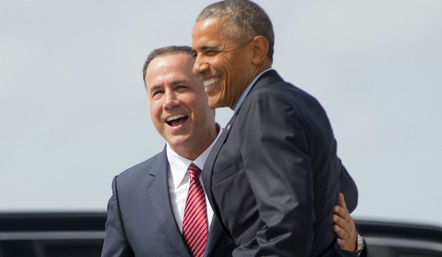 President Barack Obama is greeted by Miami Beach, Fla. Mayor Philip Levine upon his arrival on Air Force One at Miami International Airport, Wednesday, May 27, 2015, in Miami, Fla. Obama traveled to Miami to raise money for the Democratic National Committee at a pair of events at the homes of well-heeled political donors and tomorrow he will visit the National Hurricane Center to draw attention to preparedness in advance of the annual storm season that formally begins June 1. (AP Photo/Pablo Martinez Monsivais)