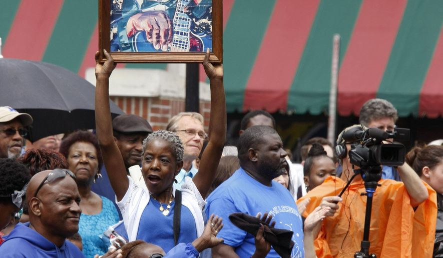A tribute for blues musician B.B. King is held in W.C. Handy Park Wednesday, May 27, 2015, in Memphis, Tenn. The city of Memphis is saying farewell to blues legend B.B. King with a tribute and processional down Beale Street on Wednesday. King died May 14 in Las Vegas. He was 89. (AP Photo/Karen Pulfer Focht)