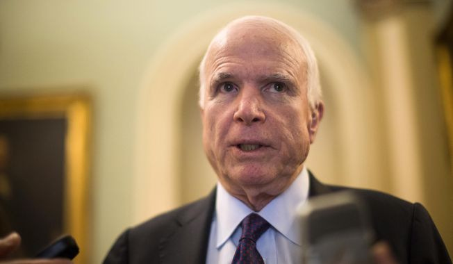 Senate Armed Services Committee Chairman Sen. John McCain, R-Ariz. speaks to reporters on Capitol Hill in Washington in this May 5, 2015, file photo. (AP Photo/Brett Carlsen, File)