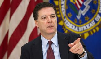 FBI Director James Comey speaks at agency headquarters in Washington on March 25, 2015. (Associated Press) **FILE**