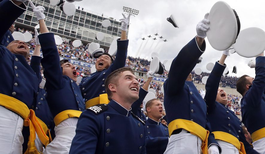 Air Force Academy graduates throw their caps into the air as F-16 jets from the Thunderbirds make a flyover, at the completion of the graduation ceremony for the class of  2015, at the U.S. Air Force Academy, in Colorado Springs, Colo., Thursday, May 28, 2015.  (AP Photo/Brennan Linsley) **FILE**