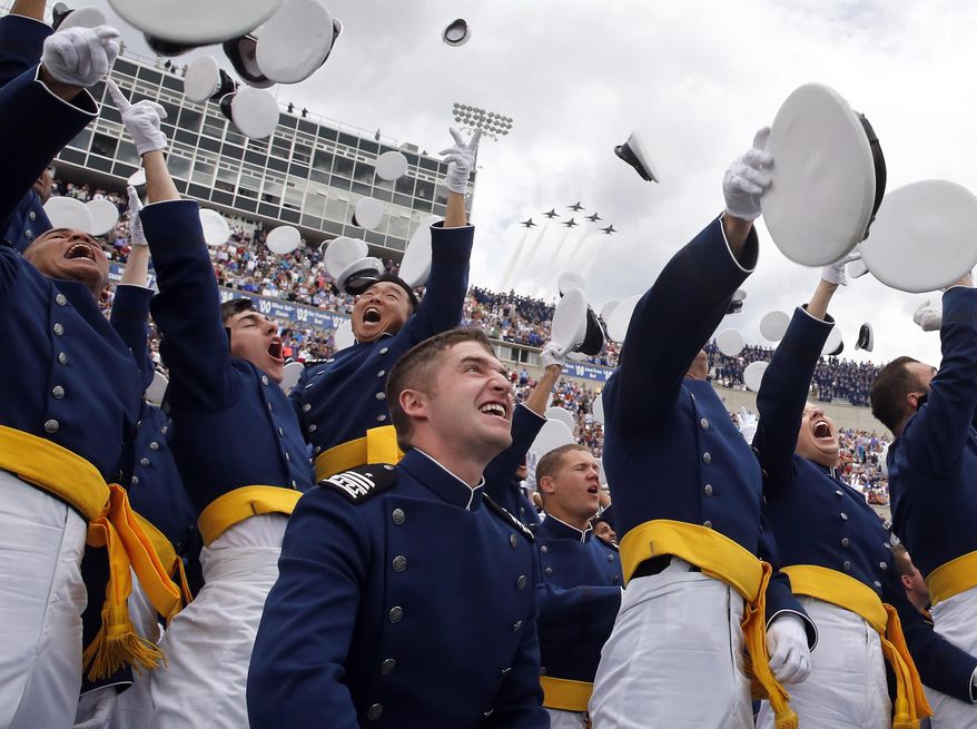 Air Force Academy graduates throw their caps into the air as F-16 jets from the Thunderbirds make a flyover, at the completion of the graduation ceremony for the class of  2015, at the U.S. Air Force Academy, in Colorado Springs, Colo., Thursday, May 28, 2015.  (AP Photo/Brennan Linsley) **FILE**