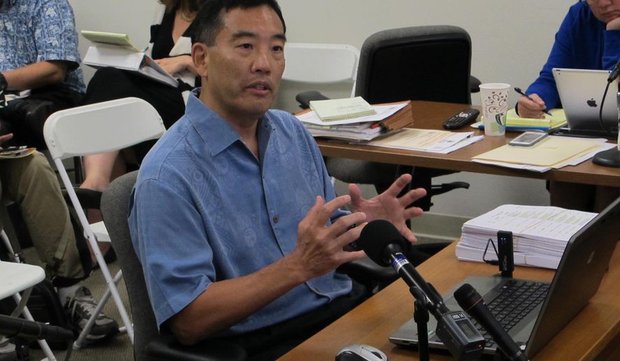 Les Kondo, executive director of the Hawaii Ethics Commission, talks about his accomplishments during the public portion of a commission meeting on Wednesday, May 27, 2015, in Honolulu. Kondo's performance is being evaluated after there were some complaints that he has been too strict about state officials and employees who receive gifts. (AP Photo/By Cathy Bussewitz)
