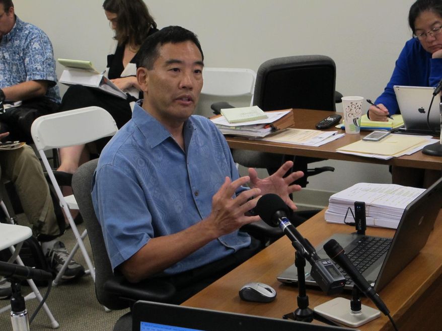 Les Kondo, executive director of the Hawaii Ethics Commission, talks about his accomplishments during the public portion of a commission meeting on Wednesday, May 27, 2015, in Honolulu. Kondo's performance is being evaluated after there were some complaints that he has been too strict about state officials and employees who receive gifts. (AP Photo/By Cathy Bussewitz)
