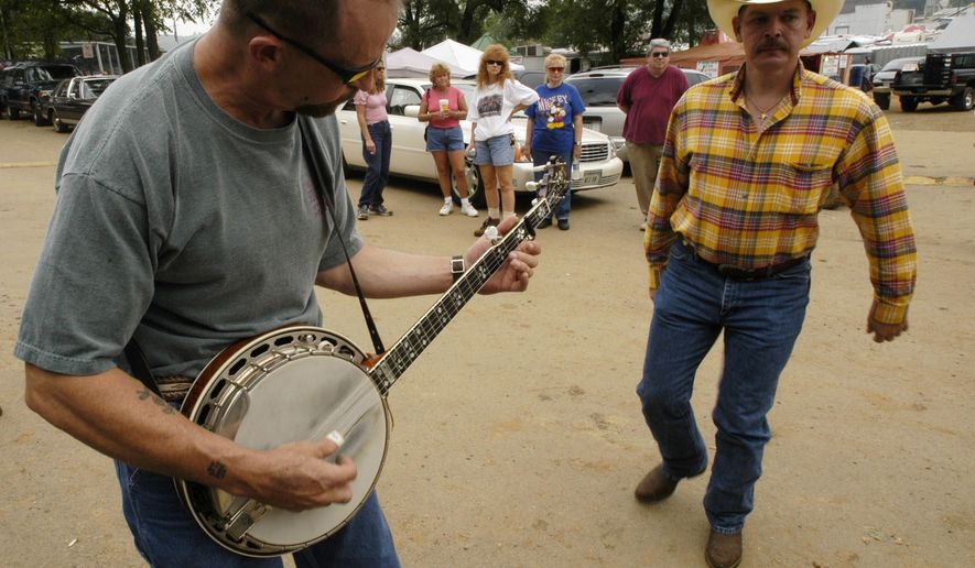 In August, fiddle players from across the country descend on tiny Galax, Virginia, for the 80th annual Old Fiddler's Convention. This year, the convention runs for a week from Aug. 3 to 8, with the words and music of banjo, mandolin, guitar and autoharp players, folk singing, country and bluegrass bands and "flatfoot dancing." (Associated Press)