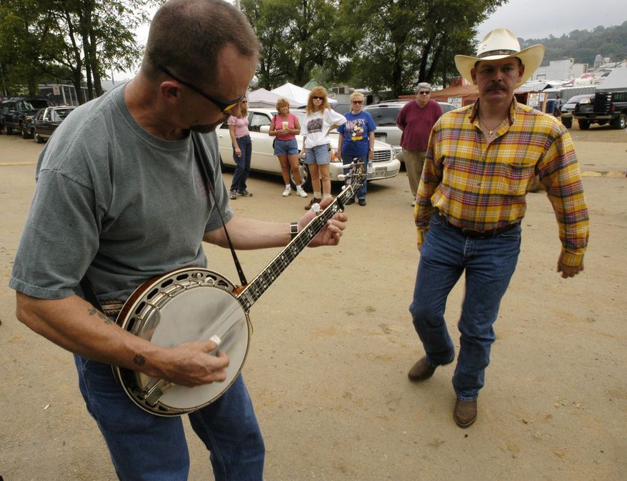 In August, fiddle players from across the country descend on tiny Galax, Virginia, for the 80th annual Old Fiddler's Convention. This year, the convention runs for a week from Aug. 3 to 8, with the words and music of banjo, mandolin, guitar and autoharp players, folk singing, country and bluegrass bands and "flatfoot dancing." (Associated Press)