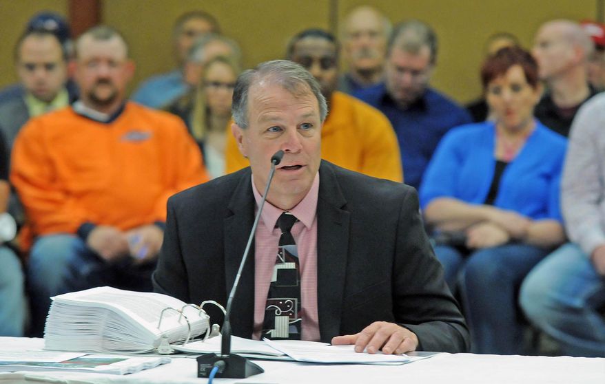 Chuck Frey, vice president of engineering for Energy Transfer, testifies in front of the North Dakota Public Service Commission on Thursday, Ma 28, 2015 about the proposed Dakota Access Pipeline project. (Tom Stromme/The Bismarck Tribune via AP)