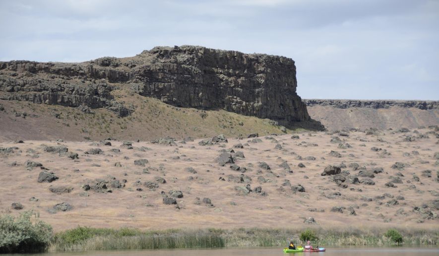 Boaters float and fish on Crane Falls Lake near Mountain Home, Idaho, May 21, 2015. Crane Falls is a great place to take a float tube, kayak or small boat. It’s the perfect size--large enough for anglers to fish without crowding each other, but small enough that you can cover the whole thing in a day of fishing out of a small boat. (Roger Phillips/The Idaho Statesman via AP) MANDATORY CREDIT