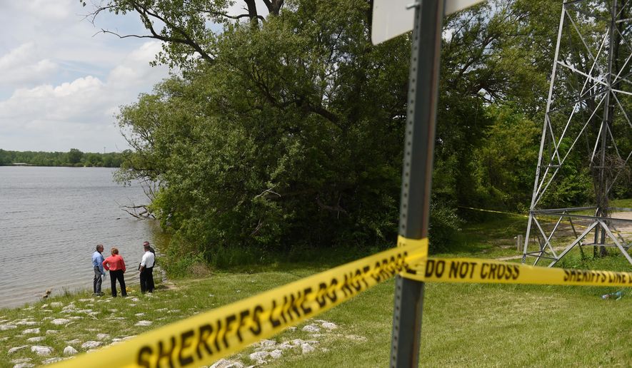 Washtenaw County Sheriff deputies use sonar technology to investigate a scene at Ford Lake off of Bridge Rd. in Ypslianti Township, Mich., on Tuesday, May 26, 2015. A wallet belonging to Tanya Jackson, who has been missing for over a year, was found near the lake. (Melanie Maxwell/The Ann Arbor News via AP) LOCAL TV OUT; LOCAL INTERNET OUT