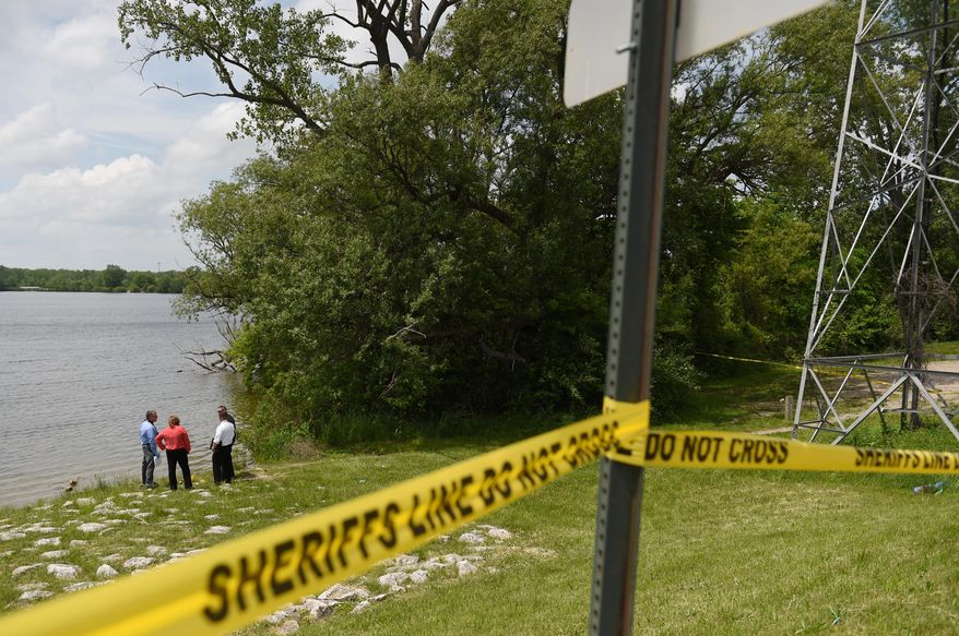 Washtenaw County Sheriff deputies use sonar technology to investigate a scene at Ford Lake off of Bridge Rd. in Ypslianti Township, Mich., on Tuesday, May 26, 2015. A wallet belonging to Tanya Jackson, who has been missing for over a year, was found near the lake. (Melanie Maxwell/The Ann Arbor News via AP) LOCAL TV OUT; LOCAL INTERNET OUT