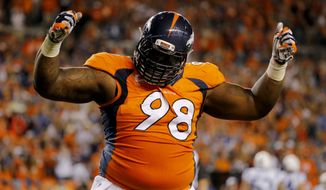 FILE - In this Sept. 7, 2014, file photo, Denver Broncos defensive tackle Terrance Knighton celebrates a stop during the second half of an NFL football game against the Indianapolis Colts in Denver. The big debate in the Broncos locker room is whether or not 350-pound nose tackle Knighton can dunk a basketball. (AP Photo/Jack Dempsey, File)