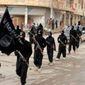 This undated file image posted on a militant website on Tuesday, Jan. 14, 2014, which has been verified and is consistent with other AP reporting, shows fighters from the al Qaeda-linked Islamic State of Iraq and the Levant (ISIL), now called the Islamic State group, marching in Raqqa, Syria.  **FILE**