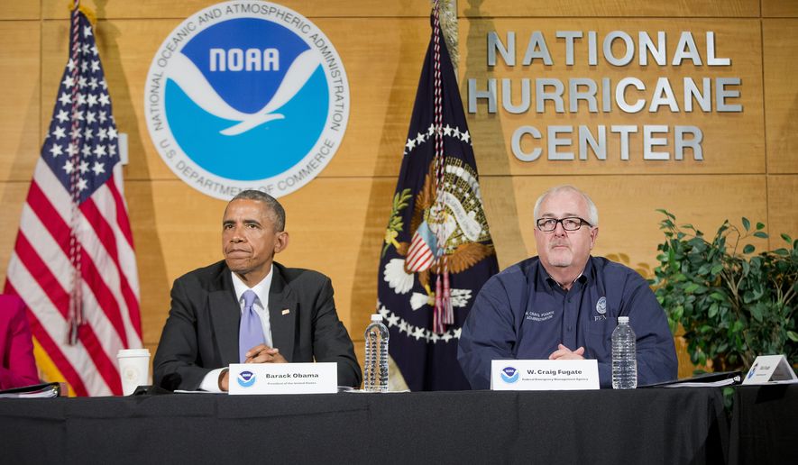 President Barack Obama, with Federal Emergency Management Agency (FEMA) Administrator Craig Fugate, participate in a briefing at the National Hurricane Center in Miami, Thursday, May 28, 2015, to draw attention to preparedness in advance of the annual storm season that formally begins June 1. (AP Photo/Pablo Martinez Monsivais)