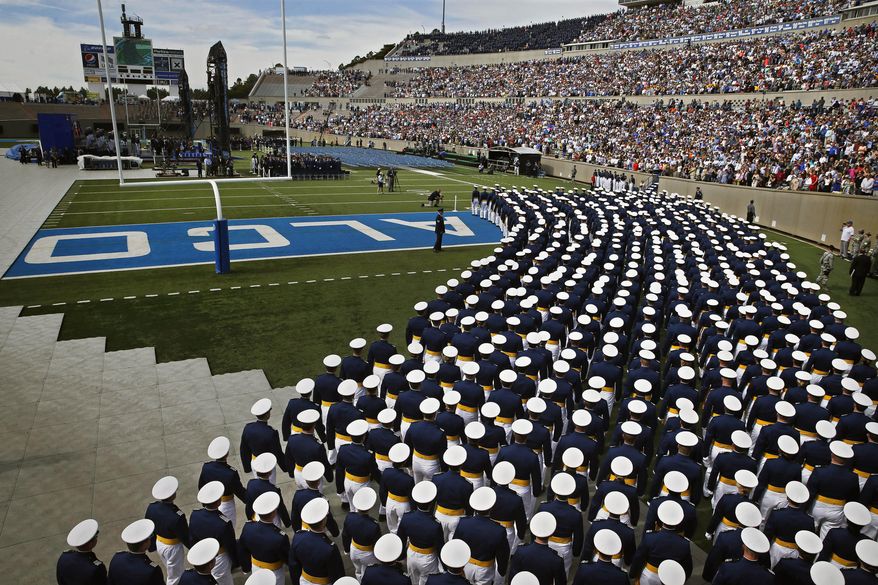 Graduating Air Force Academy cadets assemble in unison for their graduation ceremony for the class of 2015, at the U.S. Air Force Academy, in Colorado Springs, Colo., Thursday, May 28, 2015. (AP Photo/Brennan Linsley)