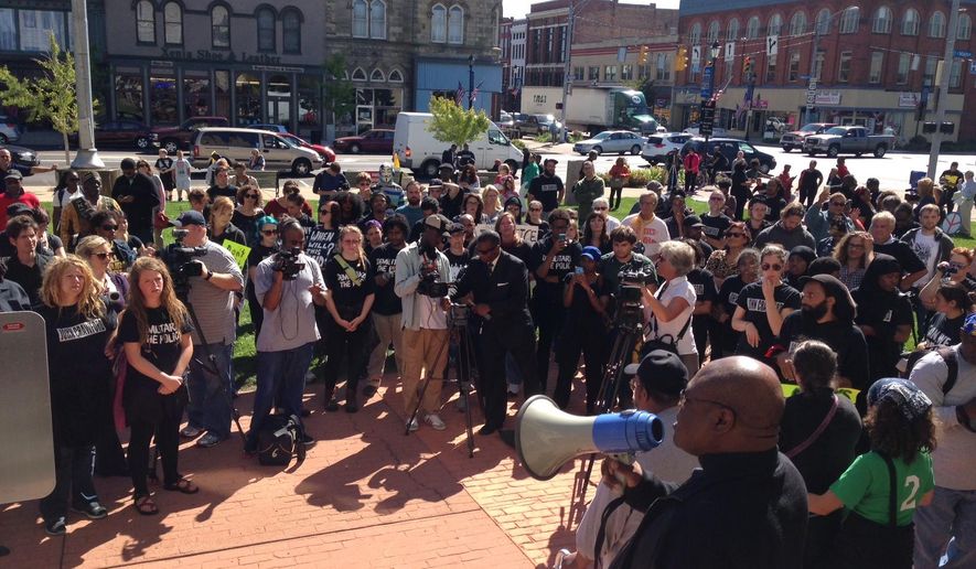 FILE-This Monday, Sept. 22, 2014 file photo shows about 100 people rallying in support of John Crawford Jr. and his family in their pursuit for answers into the shooting of John Crawford III, in Beavercreek,, Ohio. Angela Byers, the new head of the FBI’s Cincinnati division says agents are conducting a thorough review of last year’s fatal police shooting of a black man in a suburban Dayton Wal-Mart store. (Ty Greenlees,The Daily News via AP, File)