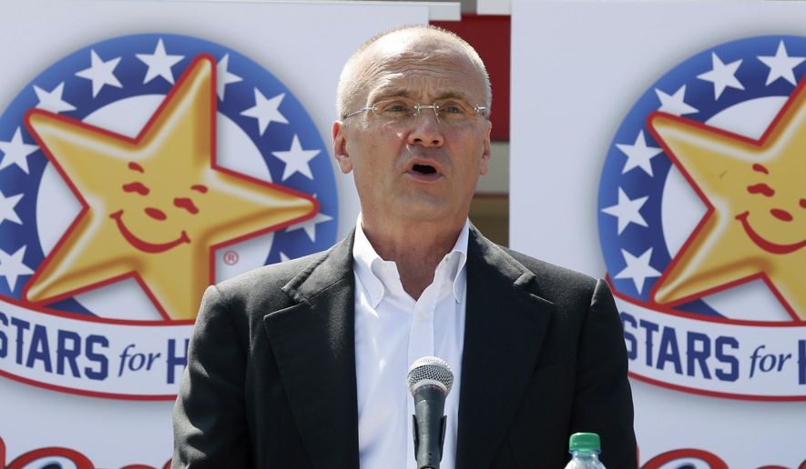 In this Aug. 6, 2014, file photo provided by CKE Restaurants, company CEO Andy Puzder speaks at a news conference in Austin, Texas, to highlight Carl’s Jr.’s commitment to the state. (Jack Plunkett/CKE Restaurants via AP)