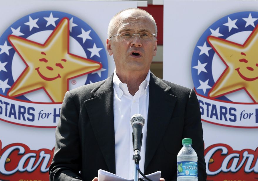 In this Aug. 6, 2014, file photo provided by CKE Restaurants, company CEO Andy Puzder speaks at a news conference in Austin, Texas, to highlight Carl’s Jr.’s commitment to the state. (Jack Plunkett/CKE Restaurants via AP)