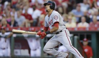 Washington Nationals&#39; Ian Desmond hits a single off Cincinnati Reds starting pitcher Anthony DeSclafani to drive home Michael Taylor in the fifth inning of a baseball game, Friday, May 29, 2015, in Cincinnati. (AP Photo/John Minchillo)