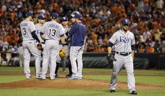 Tampa Bay Rays relief pitcher Xavier Cedeno, right, walks off the field after being relieved after Baltimore Orioles&#39; Chris Davis singled in the ninth inning of a baseball game, Friday, May 29, 2015, in Baltimore. Baltimore won 2-1. (AP Photo/Patrick Semansky)