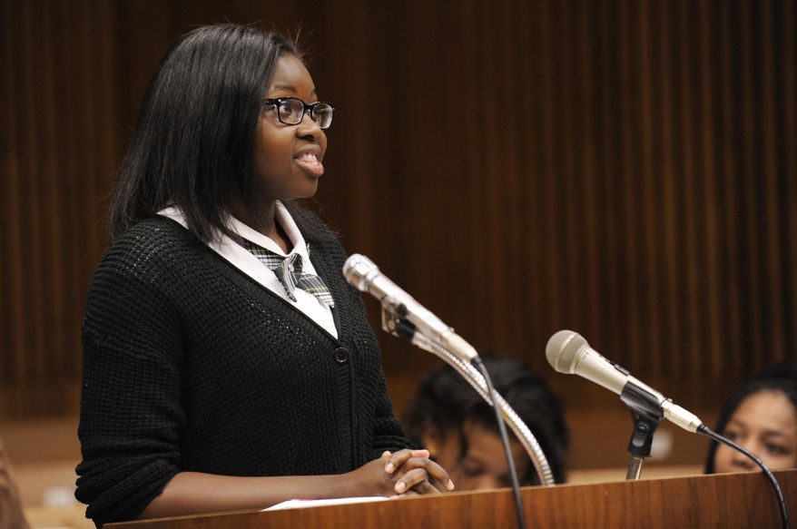 Lauren Phillips gives her opening remarks during a mock trial before Michigan Court of Appeals Judge Michael J. Riordan in Detroit on Thursday, May 28, 2015. Junior high students from the Detroit area have taken on bullying in the mock trial. Students from Cornerstone Charter Schools' Washington-Parks Academy in Redford Township made their case Thursday in Detroit. They have been preparing for the mock trial since last fall, with help from law students from the Western Michigan University Cooley Law School. (Clarence Tabb Jr./Detroit News via AP)